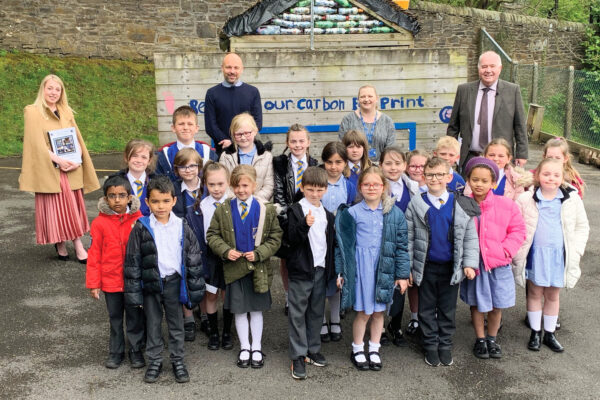 The inspirational children of St Mary’s Roman Catholic Primary School with Sara Britcliffe MP (left), Head Teacher Michael Mashiter (centre left), Year Three Teacher Mrs Lucy Southworth (centre right) and Tony Grimshaw OBE Director of What More UK (right)