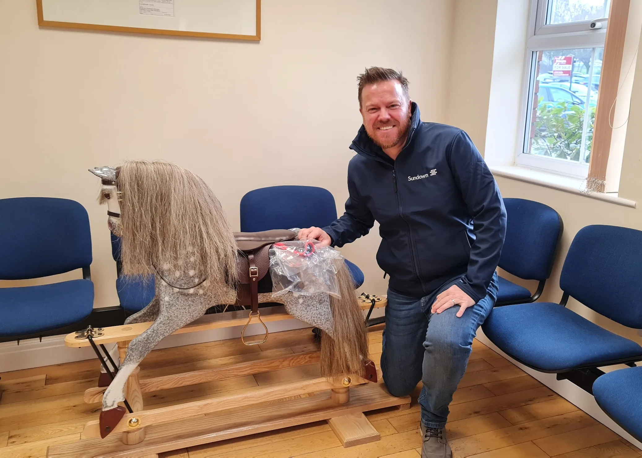 Sundown Solutions support Age Concern Lancashire and win a rocking horse