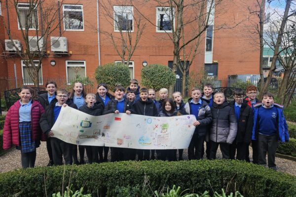 Students with a banner created during one of the workshops